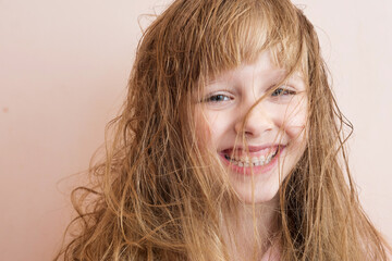 Wall Mural - a blonde girl with very matted hair laughs
