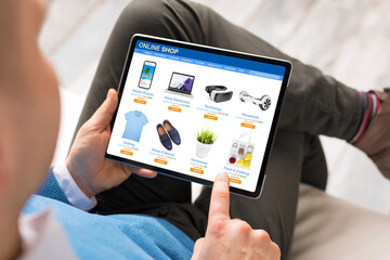 Man shopping at online store on his tablet computer