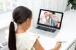 © Angelov - New normal online Christmas celebration. children using laptop to celebrate Christmas with father via video chat, happy holidays, outdoor