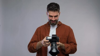 Wall Mural - photography, profession and people and concept - video portrait of happy smiling man or photographer with digital camera over grey background