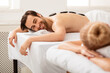 © Prostock-studio - Couple Enjoying Stone Massage Lying And Relaxing At Spa Salon