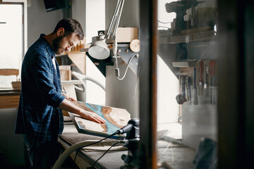 Wall Mural - Man polish a wood. Worker with polishing machine.