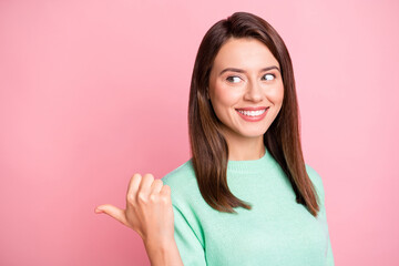 Wall Mural - photo of charming girl direct thumb look empty space shiny smile wear teal sweater isolated pink col