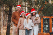 © travnikovstudio - Beautiful family with kids walking at Christmas day