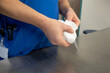 © karegg - surgical instrument is cleaned with a white cloth