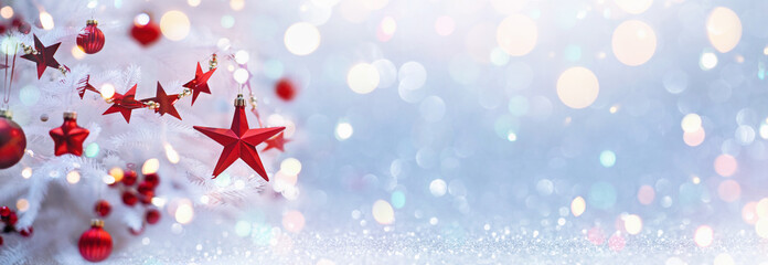 Wall Mural - Holiday Background With Christmas Tree And Red Stars. Shining Bokeh Effects