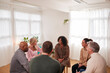 © Monkey Business - People Attending Support Group Meeting For Mental Health Or Dependency Issues In Community Space