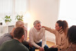 © Monkey Business - Group Consoling Man Speaking At Support Group Meeting For Mental Health Or Dependency Issues