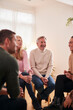 © Monkey Business - People Attending Support Group Meeting For Mental Health Or Dependency Issues In Community Space