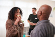 © Monkey Business - Group Of People Drinking Coffee And Chatting At Informal Meeting To Discuss Community Issues