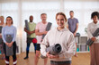 © Monkey Business - Portrait Of People In Exercise Clothing Meeting For Fitness Or Yoga Class In Community Center