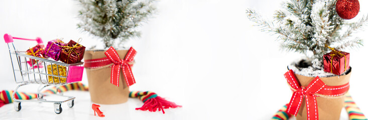 Wall Mural - Christmas tree decoration. Merry Christmas horizontal banner. Small tree isolated on white background.