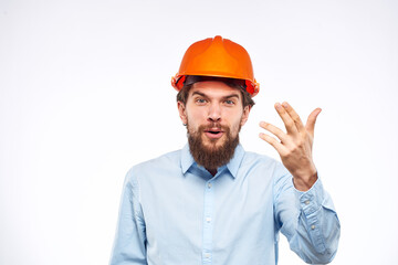 Emotional man in blue shirt orange helmet industry security Professional