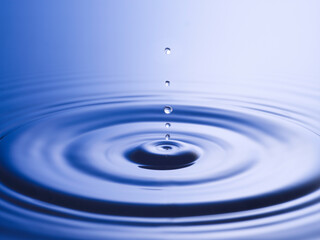  Drops hitting surface of water close-up