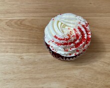 Red Velvet Cupcake On A Wooden Table