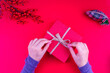 girl opening red christmas gift box in red new year concept