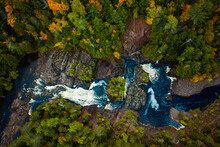 Incredible Look Down Travel Aerial Photograph Of Saxon Falls Waterfall, Cascades And Whitewater Rapids Meandering Through The Rocks On The Montreal River On The Border Between Wisconsin And Michigan.