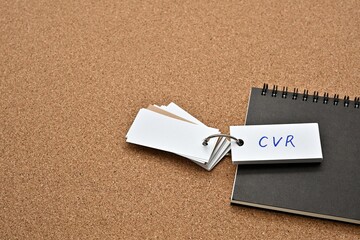 Leinwandbilder - On top of the notebook on the cork board is a wordbook with the word CVR written on it. It means Conversion Rate.