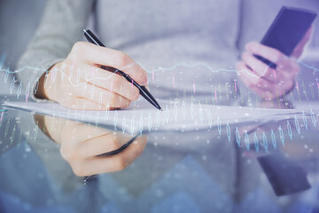 Aufkleber - Double exposure of forex chart sketch hologram and woman holding and using a mobile device. Financial market concept.