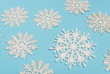 Top View Of Winter Snowflakes On Blue 