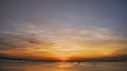 Wall Mural - Fast Time lapse cloudy sky with sunset over the sea, natural landscape