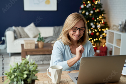 Cuadros en Lienzo Mature woman during video conference over the holiday season