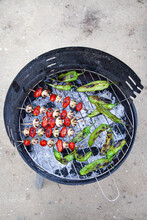 Tomato And Mushroom Skewers And Green Peppers On A Barbecue