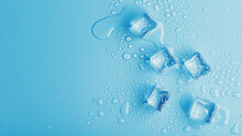 Ice Cubes With Drops Of Melt Water Water On A Blue Background, Top View.