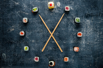 Poster - watch sushi with chopsticks by the arrows, the concept of time to eat