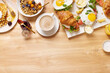 © Foodlovers - Healthy sunday breakfast with croissants, waffles, granola and sandwiches