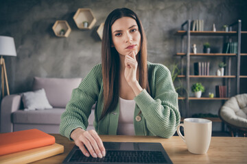 Sticker - Portrait of think brunette girl video call work from home fist chin wear green shirt indoors