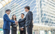 © Ann Rodchua - Business men shake hand to deal agreement