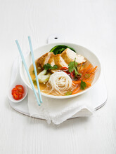 Chicken Noodle Soup With White Thin Noodles, Pak Choi, Carrot, Green Chilli And Coriander