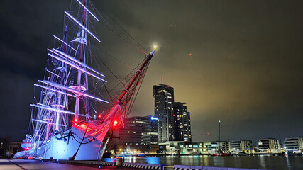 Polish sailing ship SV Dar Pomorza by night at the waterfront in Gdynia, Poland