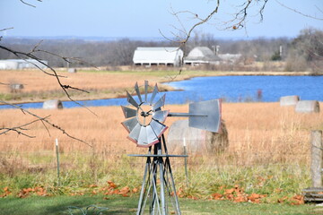 Canvas Print - Windmill with a Lake in the Distance