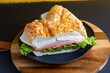 
white cheese sandwich with lettuce, tomato and ham