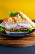 
white cheese sandwich with lettuce, tomato and ham