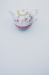 Sticker - Vertical shot of teapot isolated on white background