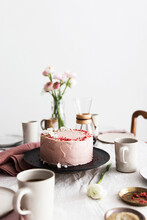 A Strawberry Cream Cake On Table Laid For Coffee
