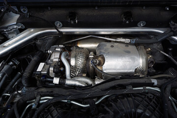 The turbocharger is installed on the engine of a modern powerful car.