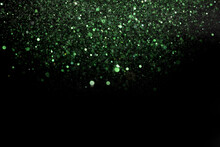 Beautiful, Sparkling Green Glitter Pouring Down From Above On A Dark Background