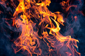 Fire flames. Flames and smoke on a dark background.