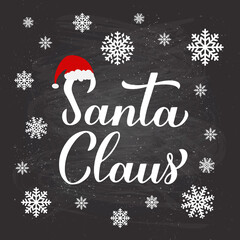 Wall Mural - Santa Claus calligraphy hand lettering on chalkboard background with snowflakes. New Year and Christmas typography poster. Vector template for greeting card, banner, flyer, logo design, etc.