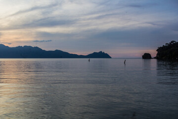 Wall Mural - Sunset at a sea in Bako National Park, Sarawak, Malaysia