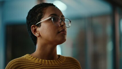 Aufkleber - Close Up Portrait of a Young Latina with Short Dark Hair and Glasses Posing for Camera in Creative Office. Beautiful Diverse Multiethnic Hispanic Female Wearing Yellow Jumper is Happy and Smiling.