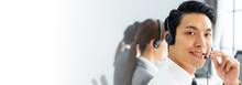 Banner Asian Man Call Center, Customer Service, Telesales In Casual Touch Headset Or Headphone And Look At Camera