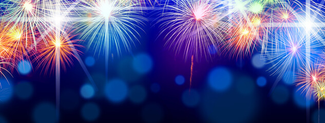 Fireworks happy new year Many colorful colors stacked on a black background In the middle there is a space for writing messages.