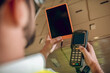 © zinkevych - Close up of workers hands holding tablet and scanner