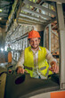 © zinkevych - Young bearded worker smiling and looking contented