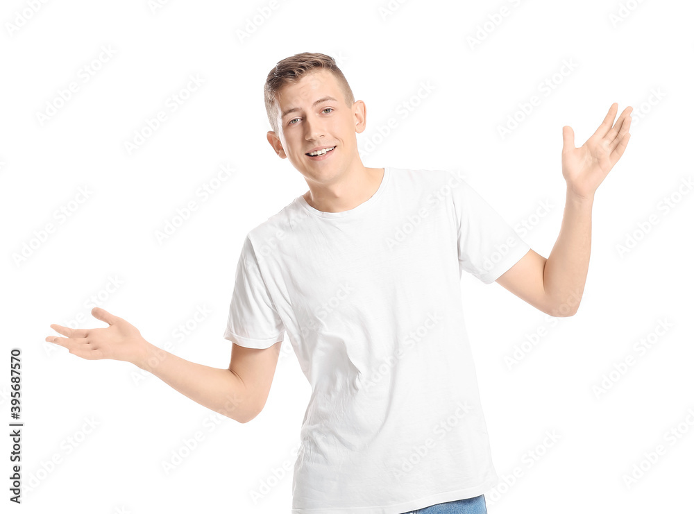 Young man showing something on white background